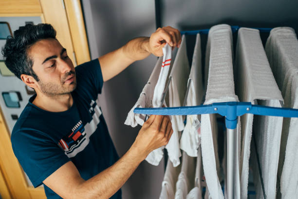 istock Man washing his clothes 1312463417