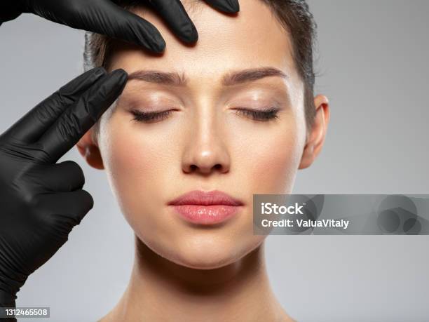 Face Skin Check Before Plastic Surgery Beautician Touching Woman Face Doctor Checks A Skin Before Plastic Surgery Beauty Treatments Plastic Surgery Doctor Is Touching Face Of A Patient By Hands Stock Photo - Download Image Now