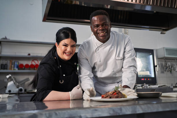 istock Proud multi-ethnic chefs, presenting their new dish on the menu 1312465840