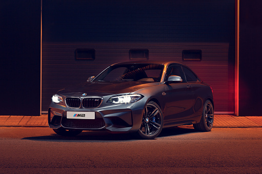 Santander, Spain - April 4, 2021: The BMW 2 Series is a high-end sports car from the German manufacturer BMW. In the image gray BMW M2 seen from the front.