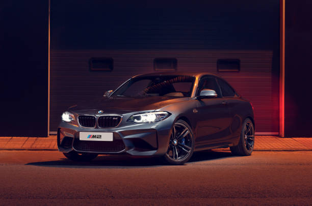 BMW M2 Series 2 Santander, Spain - April 4, 2021: The BMW 2 Series is a high-end sports car from the German manufacturer BMW. In the image gray BMW M2 seen from the front. bmw stock pictures, royalty-free photos & images