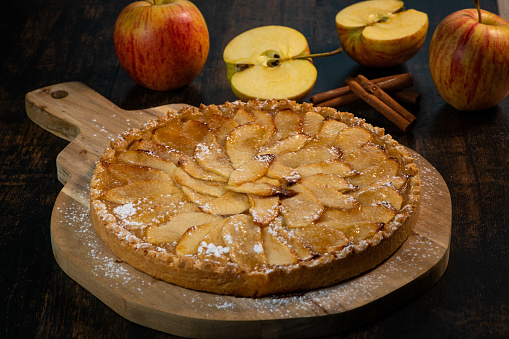Delicious apple pie on a wooden table, from above. High quality photo