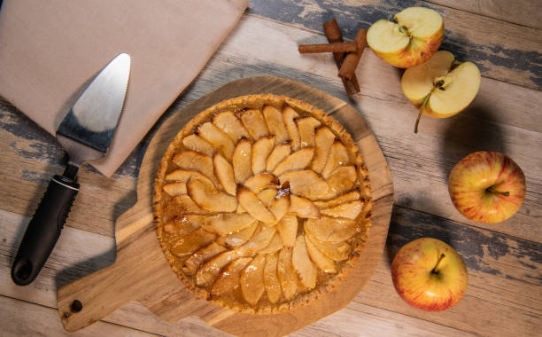 istock Delicious apple pie on a wooden table, from above 1312468523