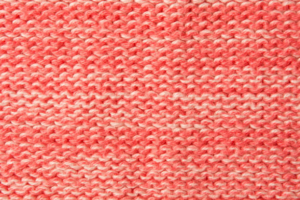 istock Closeup red woolen textured textile background. Soft warm clothes 1312470029