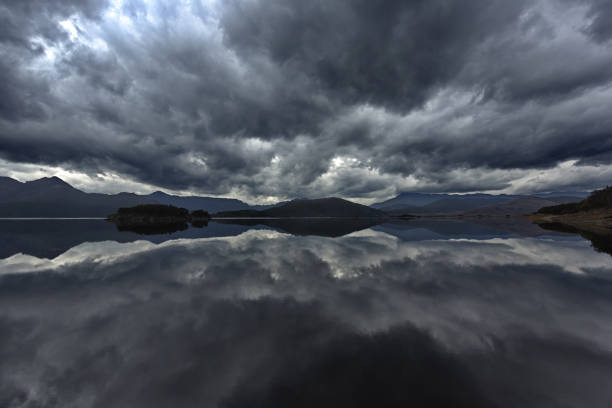 istock Rolling storm clouds and West Coast Range Mountains reflected in Lake Burbury, Tasmania 1312470817