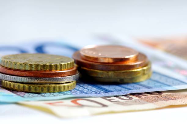 istock Coins and paper money 1312473908
