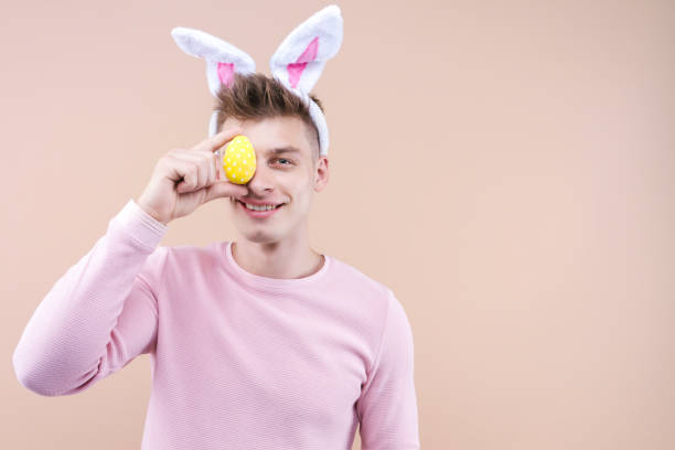 istock Funny man in bunny ears Happy Easter concept. 1312474676
