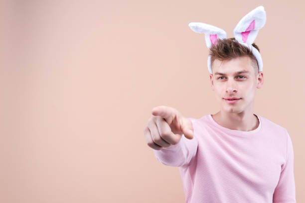 Close-Up Of Three Rabbit Against White Background