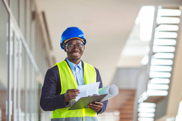 istock Successful male architect at building site looking at camera. 1312476318