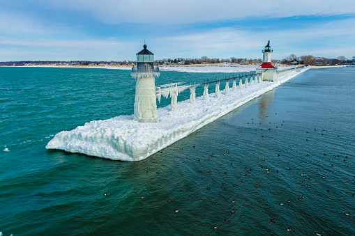 Ice Covered Pier and Lighthouse on Lake Michigan. St. Joseph Michigan.