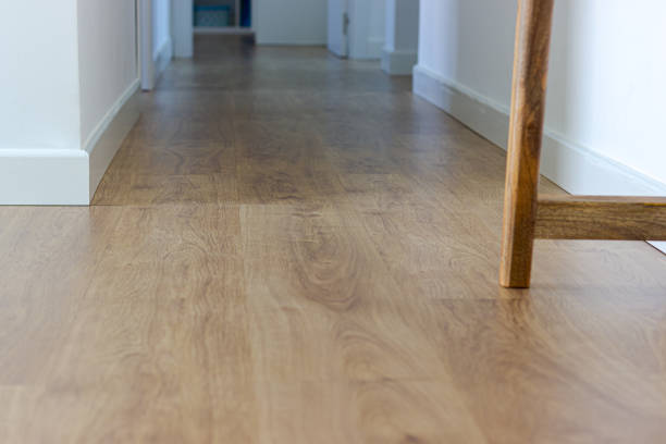 istock walnut wood flooring. view from the ground. hallway with white walls 1312480069