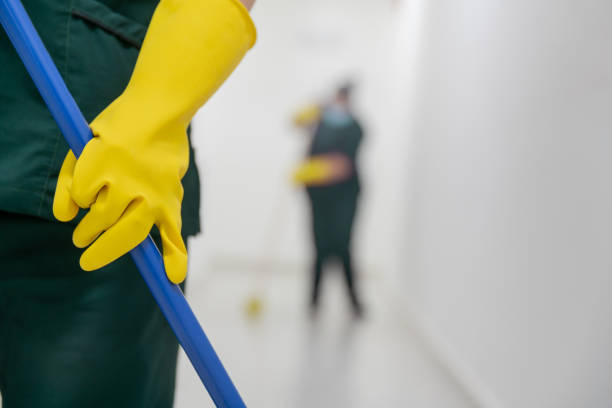 istock Close-up on a cleaner working at an office building sweeping the floors 1312481725