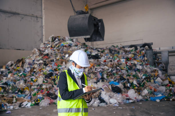 istock Engineer working in recycling centre in COVID-19 pandemic. 1312482469