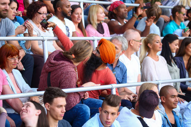 istock People taking a selfies at a footbal match 1312483117