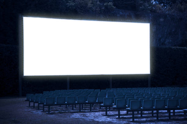 istock Outdoor cinema with chairs and white projection screen - toned image 1312483227