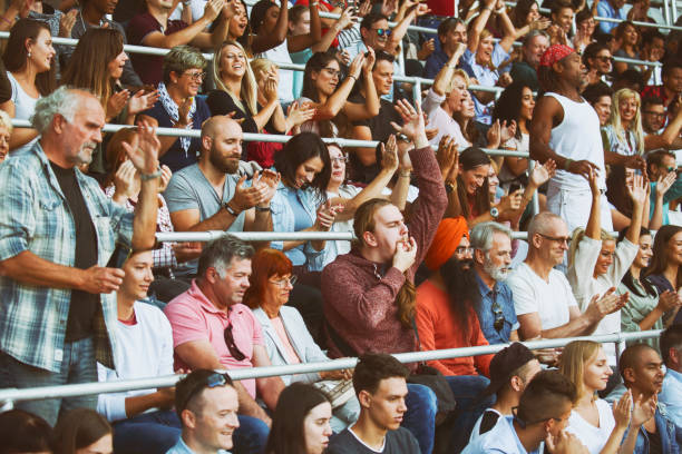 istock Ecstatic fans on the stadium cheering 1312483247