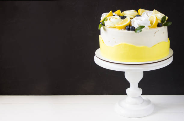 istock Lemon cake with blueberries and merinques, black background 1312483406