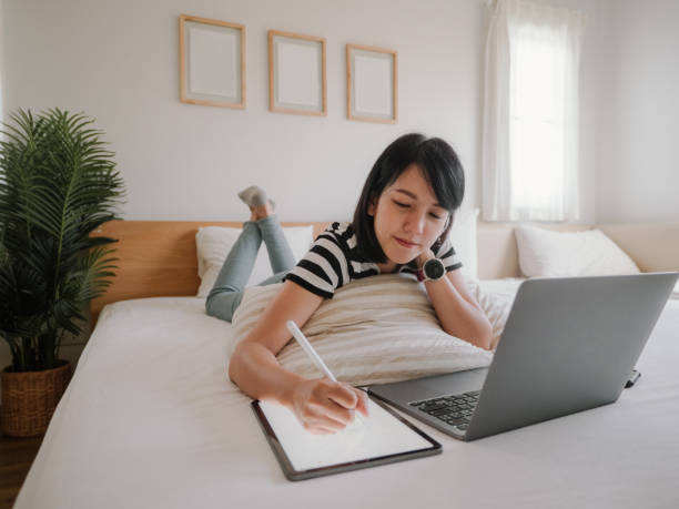 istock Asian female work at home. 1312483874