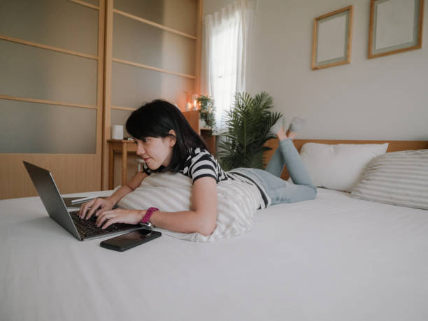 istock Asian female work at home. 1312483884