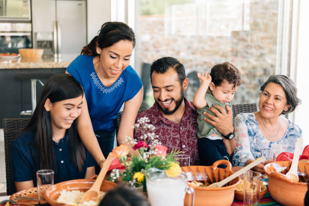 istock Multi-generation family eating together outdoors 1312484632