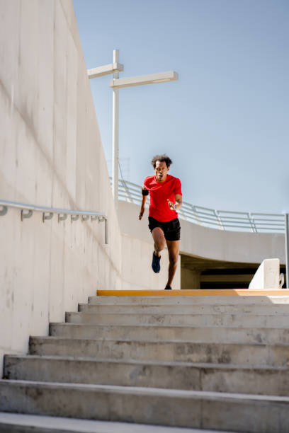 istock Afro athletic man doing exercise outdoors. 1312486462