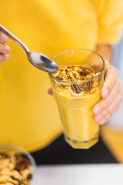 istock Close up of a healthy fruit drink with nuts 1312486648