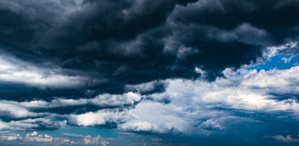 istock Stormy sky with large dark clouds, HDR artistic processing, wide banner. 1312487697
