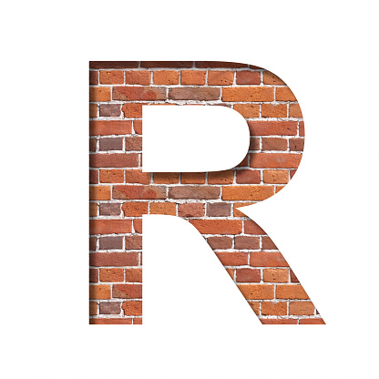 Font on brick texture. Letter R, cut out of paper on a background of real brick wall. Volumetric white fonts set.