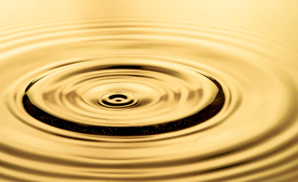 istock Water Drop falling into water with beautiful splash background 1312488062