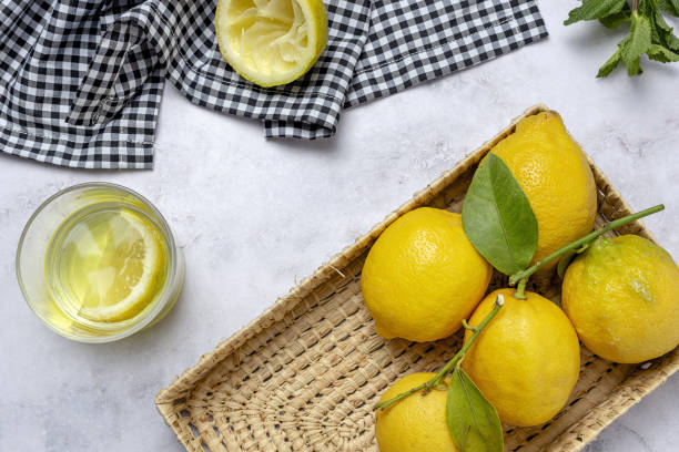 istock Fresh lemons with green mint leaves 1312489687