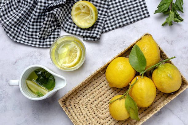 istock Fresh lemons with green mint leaves 1312489691