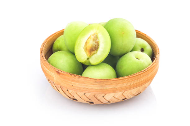 Green plum isolated on white background