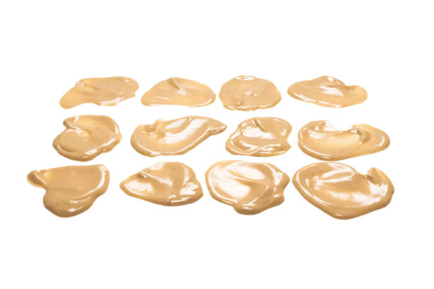 istock Mushroom sauce splashes isolated on white background. 1312490995