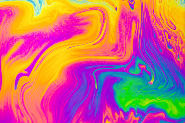 istock Rainbow colors. Psychedelic multi colored patterns background. Photo macro shot of soap bubbles 1312492228