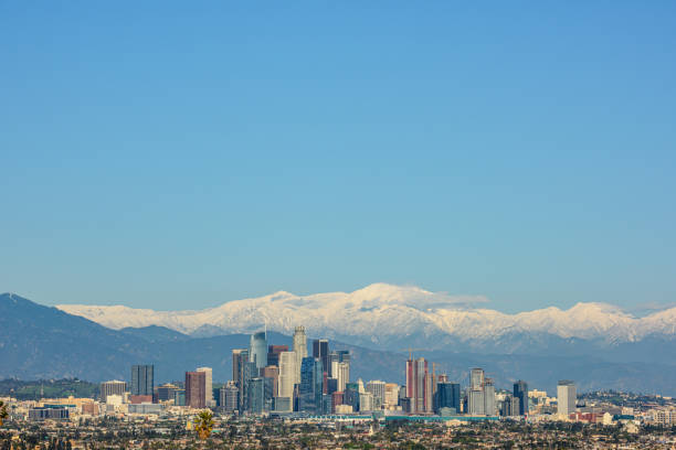 istock Downtown Los Angeles skyline with snow capped mountains behind 1312492497