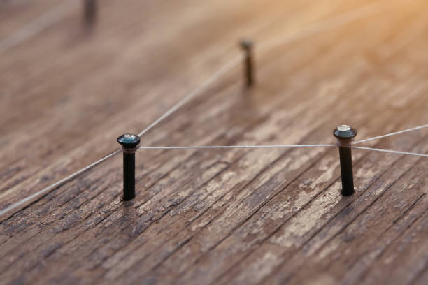 istock Network connected with yarn white on plank wood 1312492580