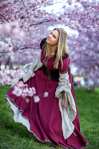 istock Beautiful Russian woman in a cherry tree forest 1312495232