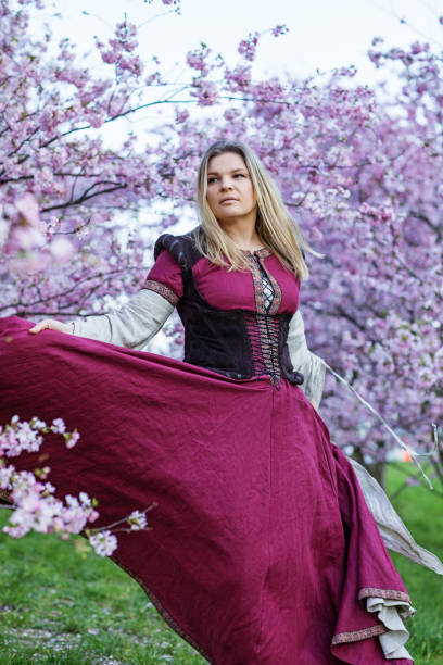 istock Beautiful Russian woman in a cherry tree forest 1312495244