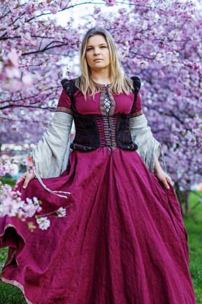 istock Beautiful Russian woman in a cherry tree forest 1312495245