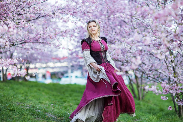 istock Beautiful Russian woman in a cherry tree forest 1312495302