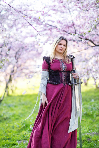istock Beautiful Russian woman in a cherry tree forest 1312495401