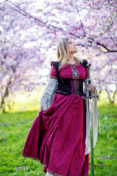 istock Beautiful Russian woman in a cherry tree forest 1312495430