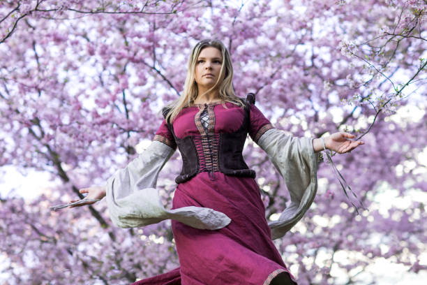 istock Beautiful Russian woman in a cherry tree forest 1312495544