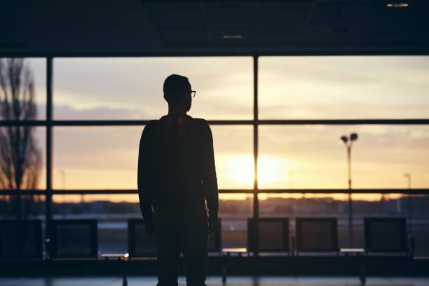 Silhouette of man at airport