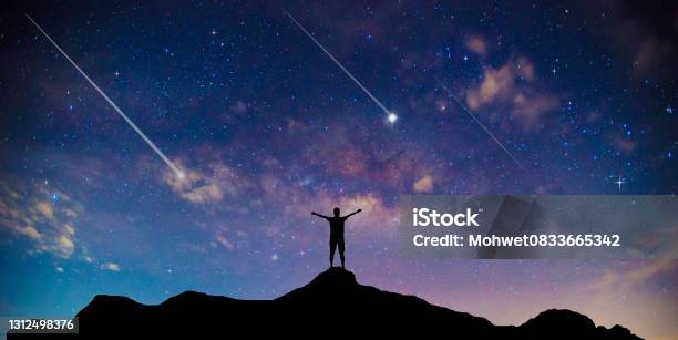 Amazing Beautiful Night Sky And Stars With Meteor Or Shooting Star As Backgroundtraveler Man Silhouette Stand Top Mountain Stock Photo - Download Image Now