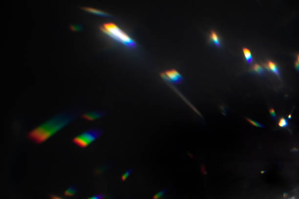istock colorful warm rainbow crystal light leaks on black background 1312498526