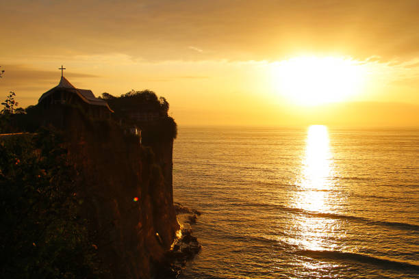 istock Beach Sunset with Church on Cliff 1312499045