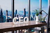 ceo; office chair in front of modern workspace and panoramic skyline view; company concept; 3D Illustration