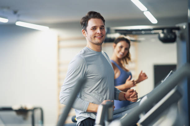 istock Two people working out on treadmill 1312500034