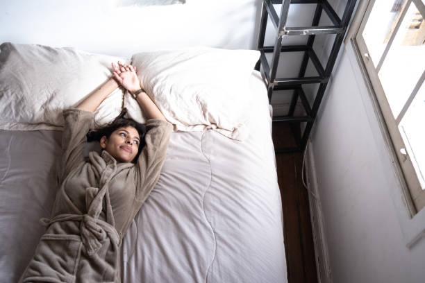 istock Young woman resting lying in bed 1312501068